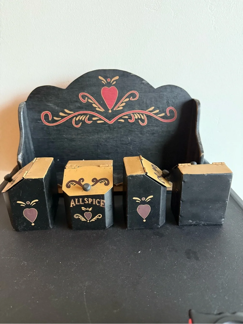 Vintage Folkart tin spice containers with wooden shelf